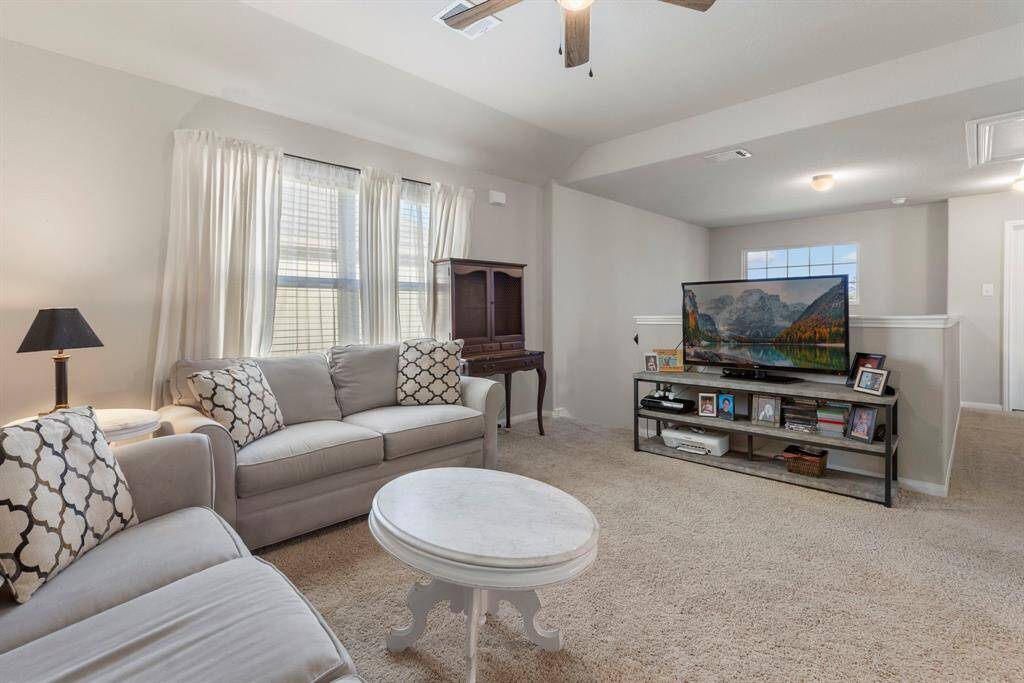 The upstairs game room is a versatile and inviting space designed for family fun and relaxation. This generously sized area provides plenty of room for a variety of activities, from movie nights and gaming marathons to a cozy reading nook or a dedicated play area for kids.