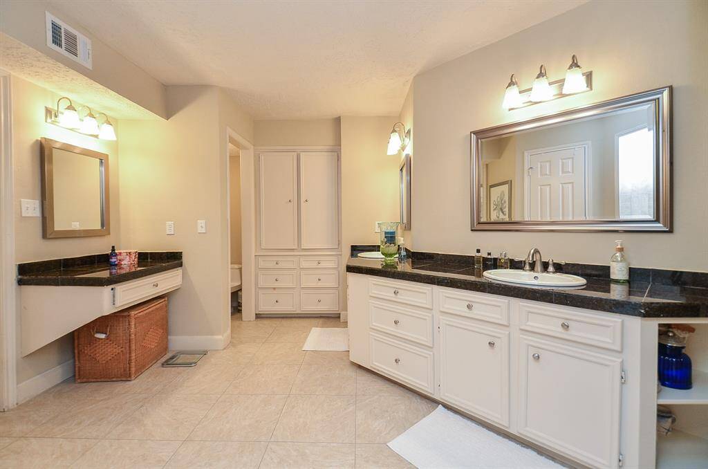 The primary bathroom is large and has incredible amounts of counter space,