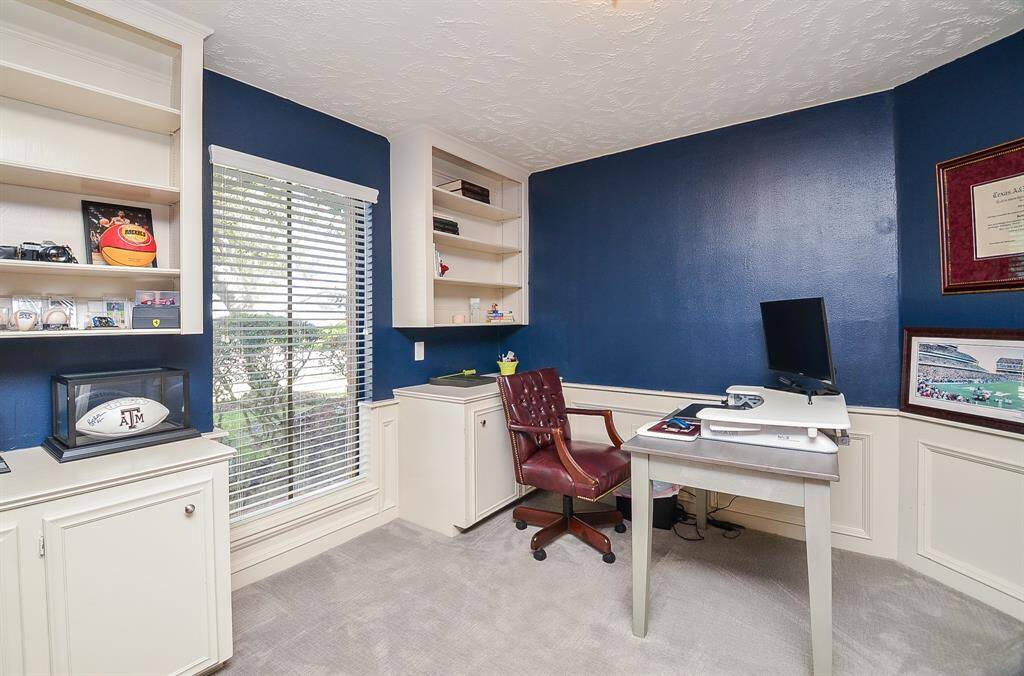 The study/home office is tucked away off a private hallway off the entry area.  It is not visible from the entry or main living area, so it is the perfect place for privacy for zoom meetings or even for someone that keeps a messy desk!