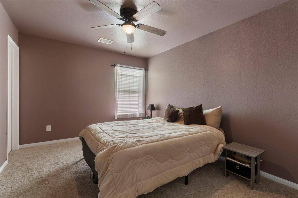 Secondary bedroom #2 has a ceiling fan, walk in closet and 2' blinds.
