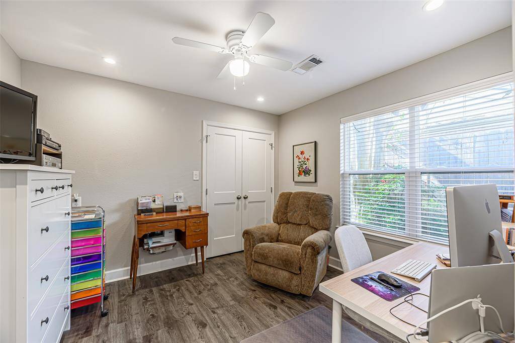 Another secondary bedroom with lvp flooring, canned lighting and ceiling.