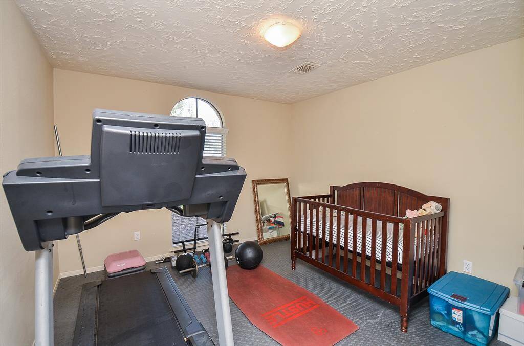 The second bedroom downstairs is perfect for a nursery, a workout room, or even a second home office downstairs.