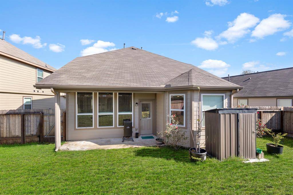 Enjoy the covered porch and large backyard!