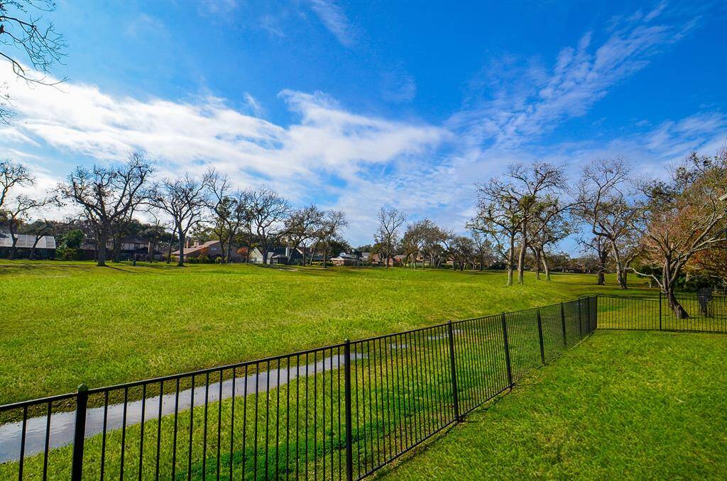 Wide views of #18.  The cart path is across the fairway so the is little activity directly behind the house and gives a private, but open space for outdoor living.