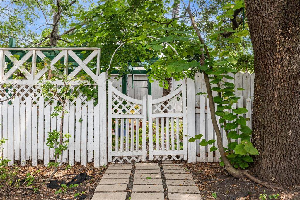 This charming pedestrian gate allows guest to enter the yard without entering the home.
