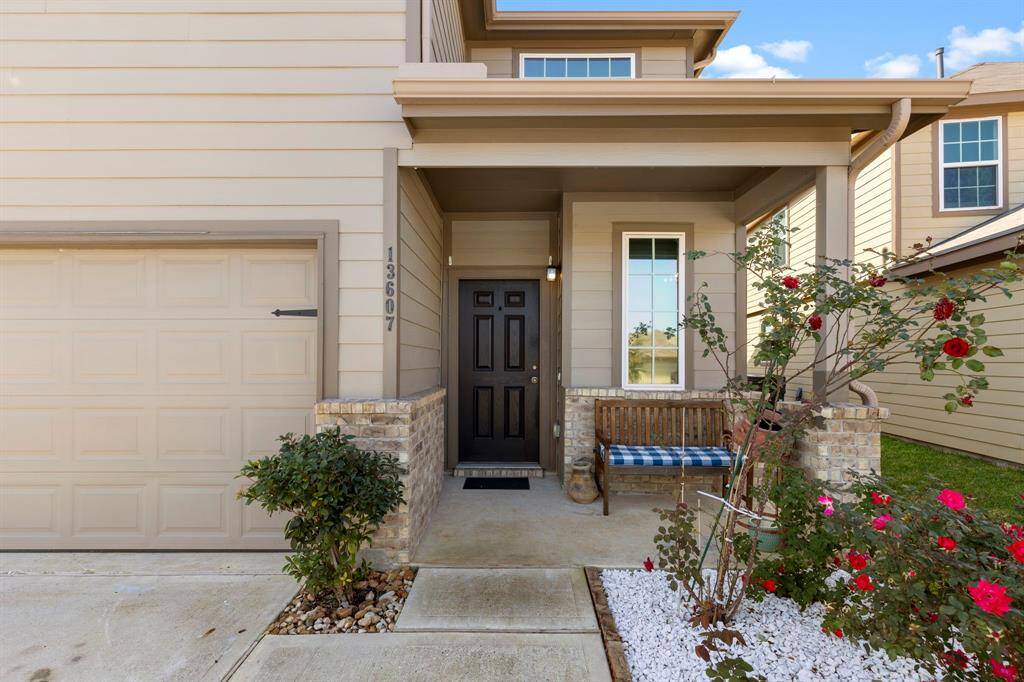 Notice the inviting front porch with brick surround and 6 panel front door!