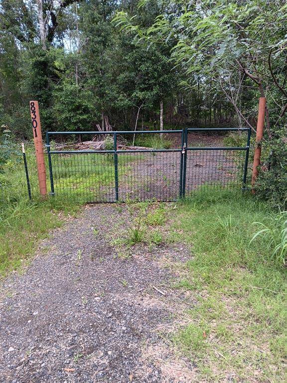 The well-marked, gated drive leading to the property.