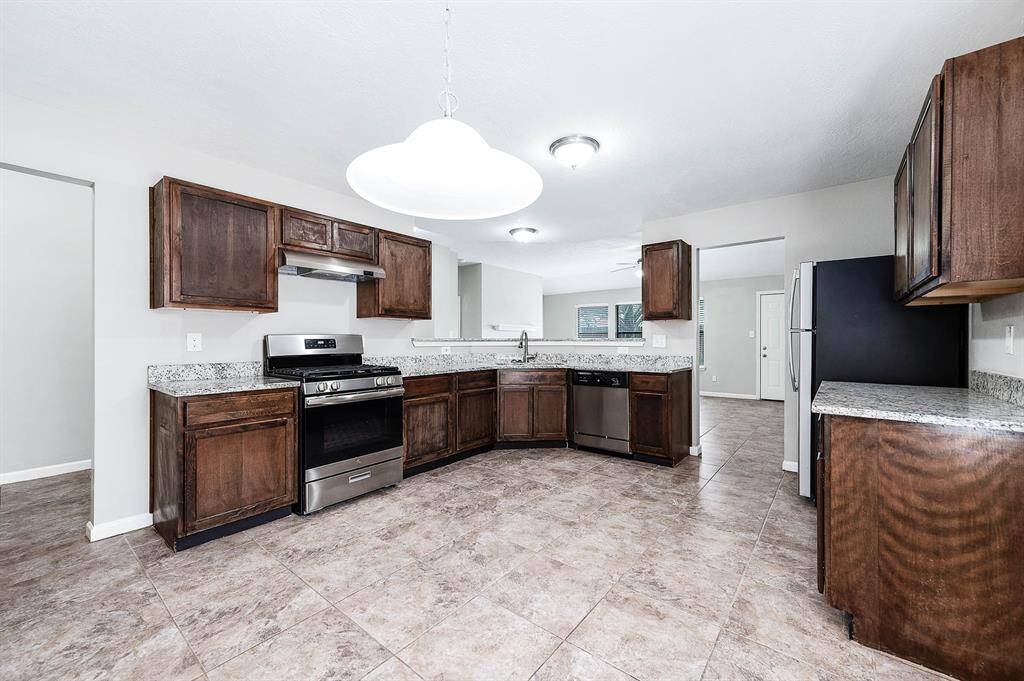 Meet all your culinary needs in this kitchen featuring SS appliance and large enough to add a center island.