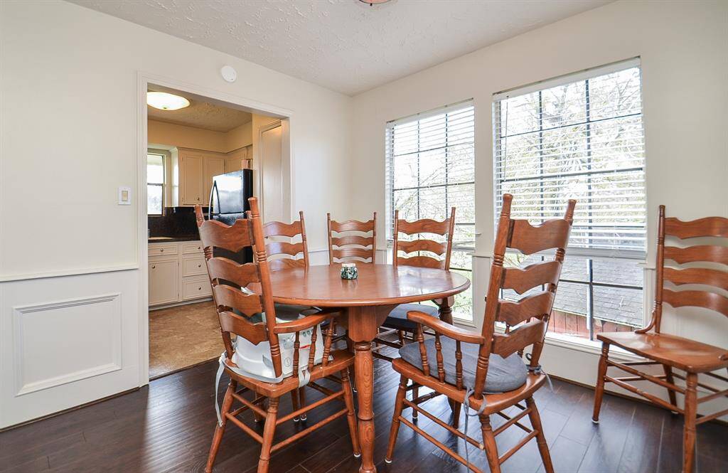 The dining area with the door to the kitchen in the background.