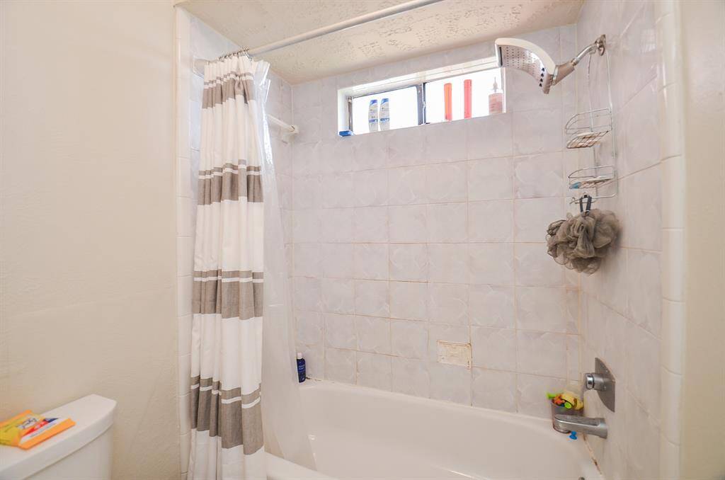 The tub/shower combo in the apartment.