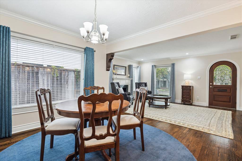 This Picture Shows The Charming Arched Door and Beveled Glass!!! Plus Note the Glistening  Hardwoods. and Again Great Windows in the Dining Area!!!