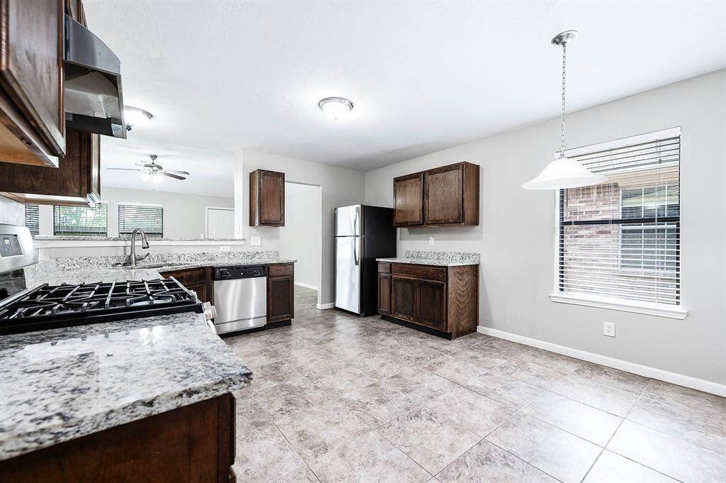 Kitchen with breakfast nook and see through into the formal living space.