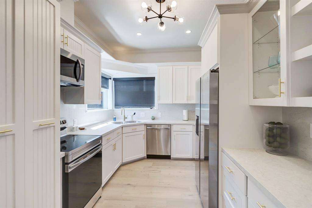 First Floor Main House: kitchen features SS appliances, quartz counters, and plenty of cabinet space