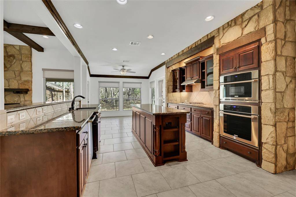 The living area is open to the kitchen and breakfast area - plenty of natural light from the large windows overlooking the back yard