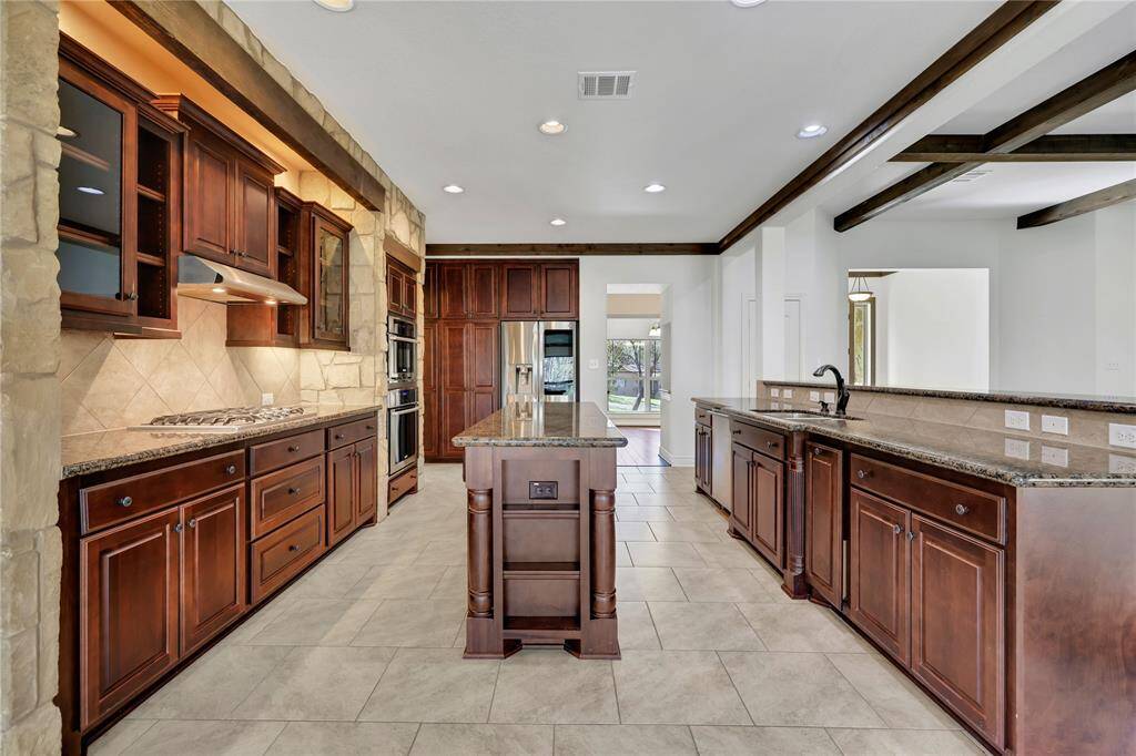 The spacious kitchen has a great center island