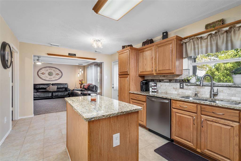 The open floor plan provides a seamless transition from your kitchen into the living room.