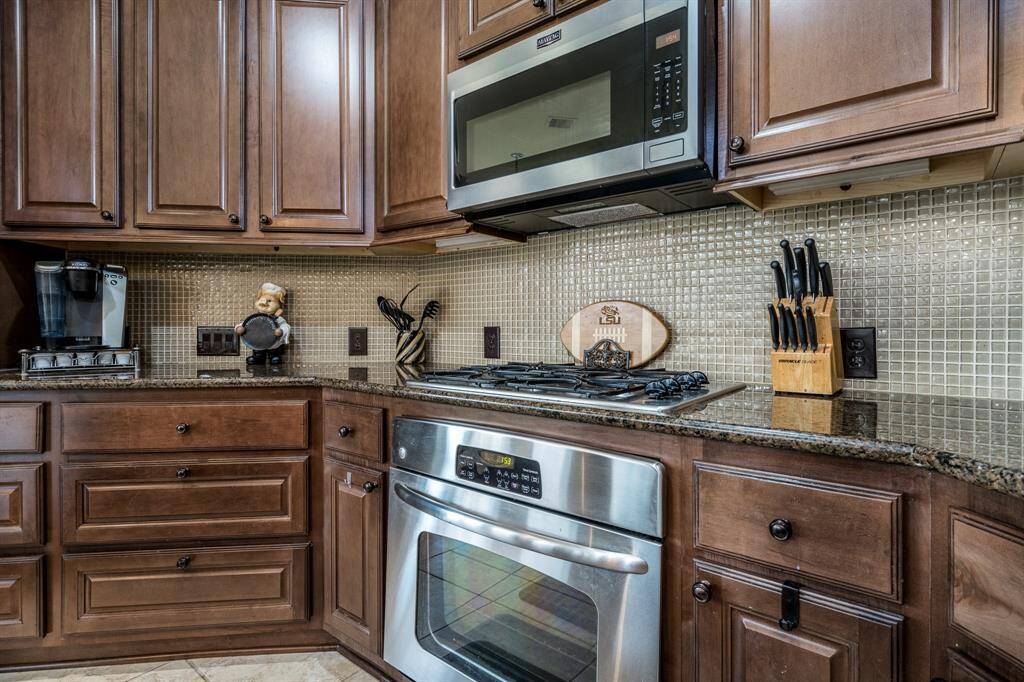 Pots and Pans soft closing drawers, gas range stove and oven.