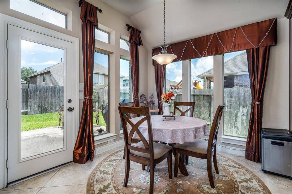 Breakfast area is flooded with natural light - thanks to the whole back wall having large windows