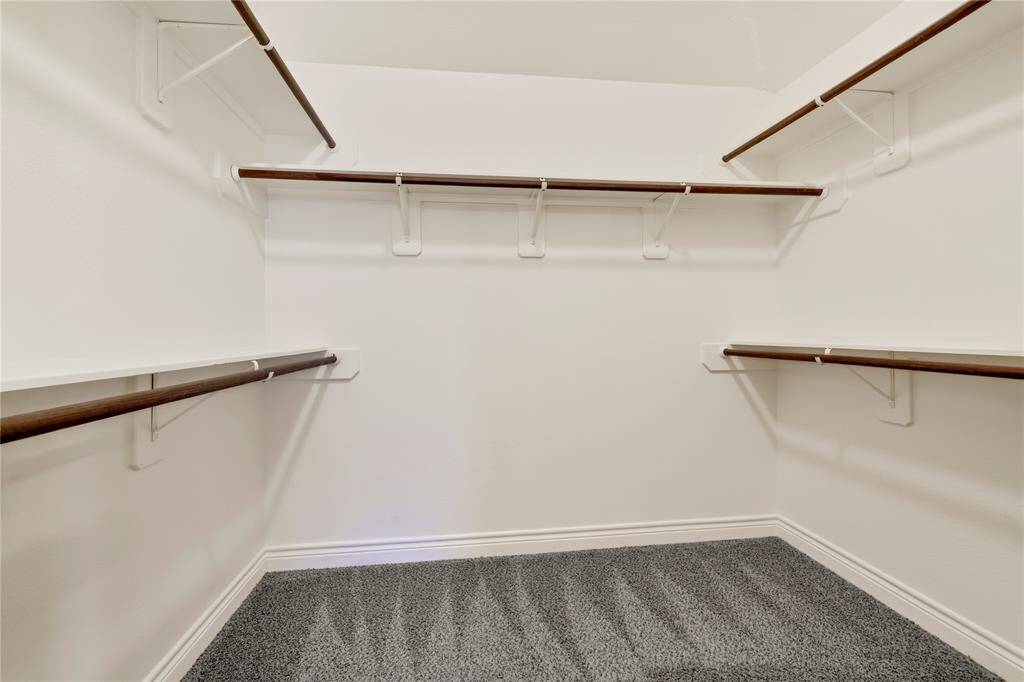 The primary bathroom is spacious and has a luxurious feel