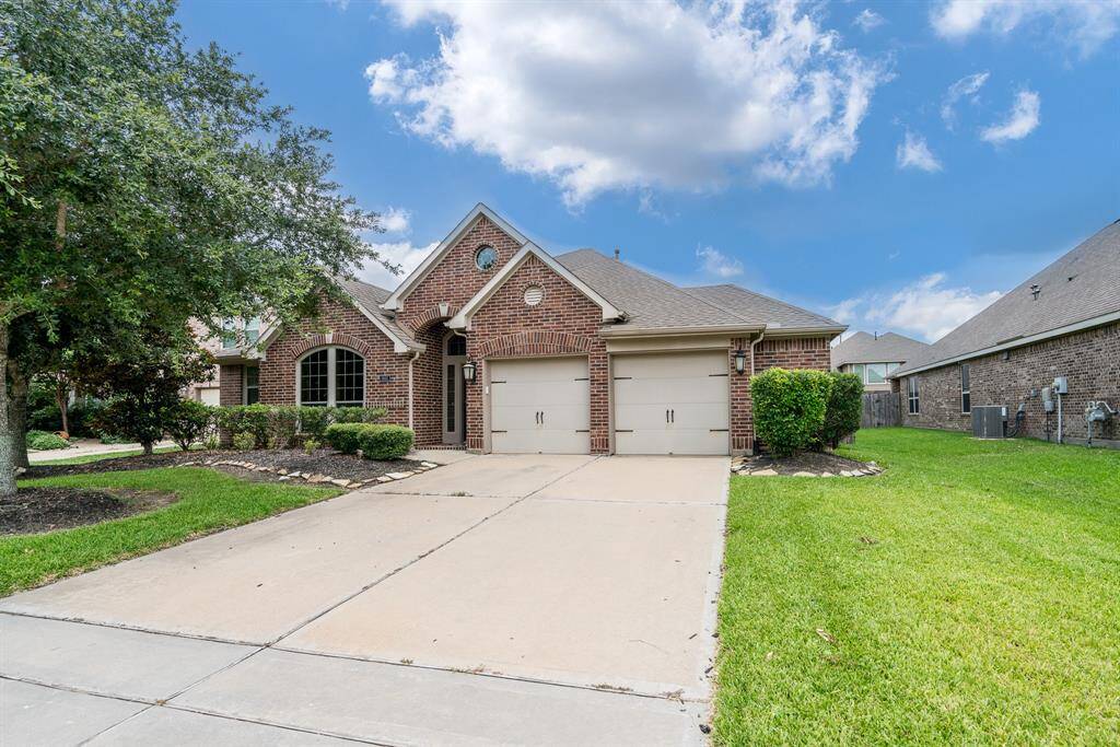 Beautiful green landscaping, two car garage