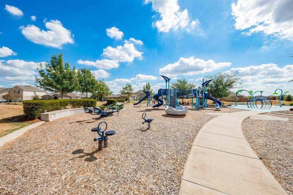 Unleash the fun at the community playground, featuring a variety of play equipment and a refreshing splash pad for hours of outdoor enjoyment.