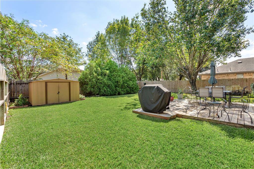 Your new backyard is perfect for entertaining, and a storage shed is conveniently located in the corner for additional space.