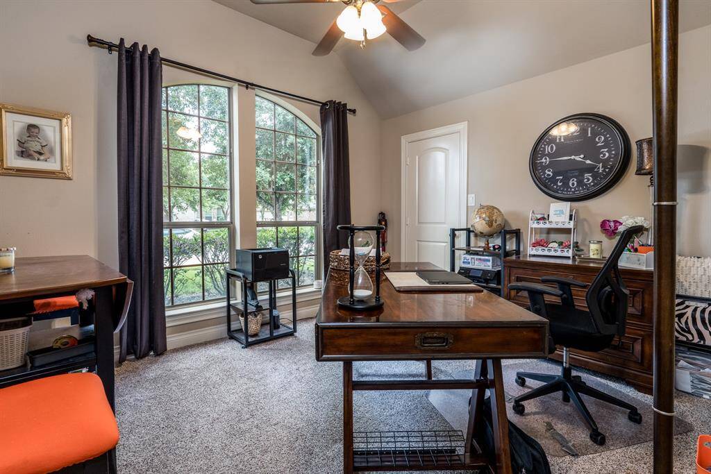 To the left of the entry is a secondary bedroom that is currently being used the home office. This room features a large window that brings in ample amounts of natural light.