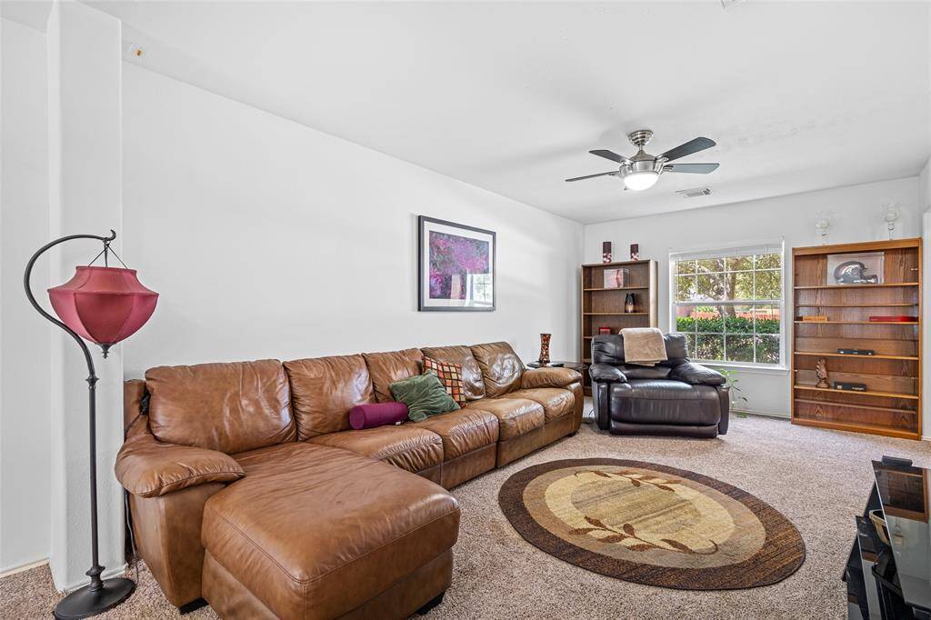 Your well-lit family room has a large window allowing for natural light.