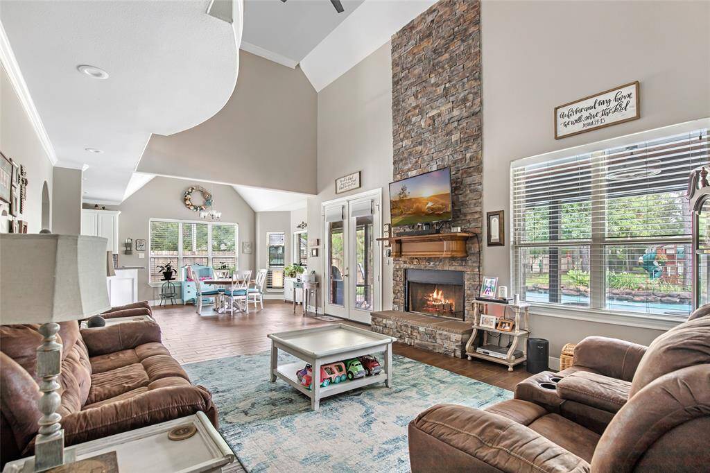 Main living area with large stone fireplace