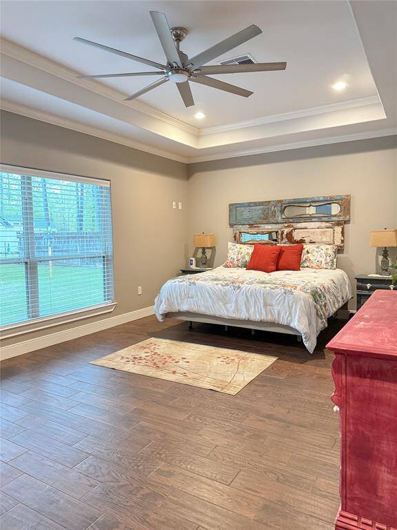 Primary bedroom with vaulted ceilings