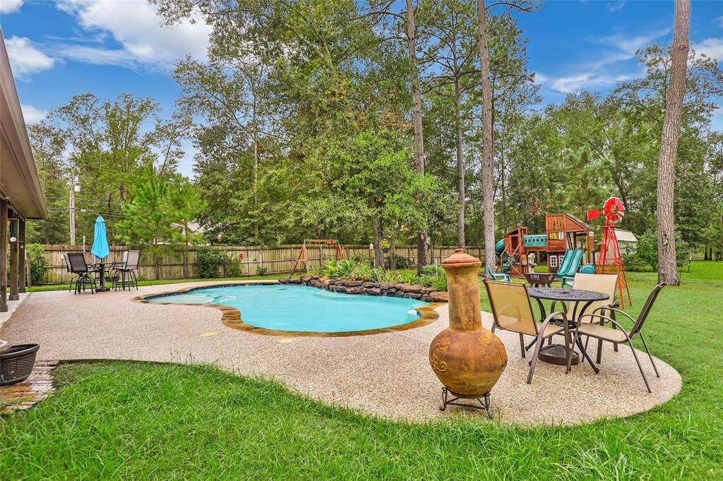 View of pool and backyard