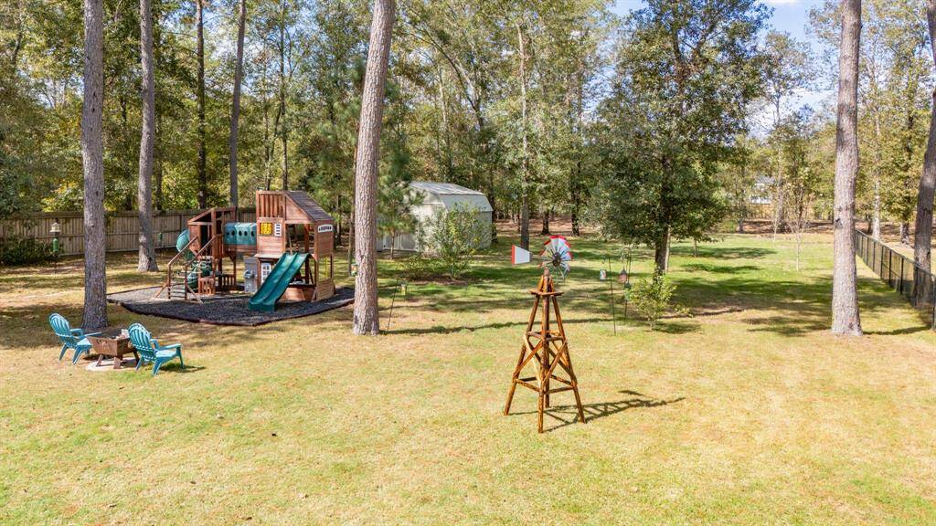 Big backyard with lots of shade trees.