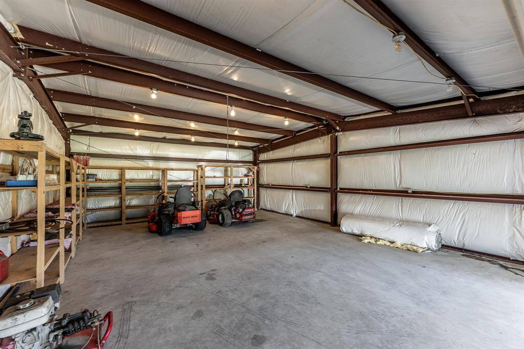Spacious side of the building with ample room for storage or projects.
