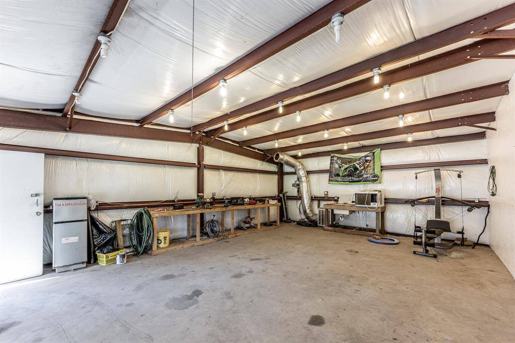 Spacious and versatile workshop area, perfect for projects and storage.