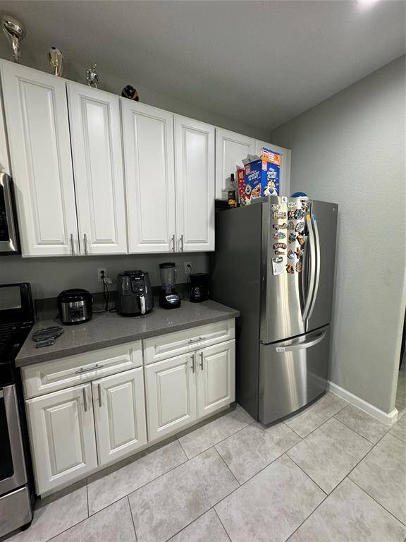 Refrigerator included in the kitchen