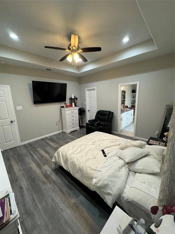 Main Bedroom with pop up ceilings, fan and recessed lights.