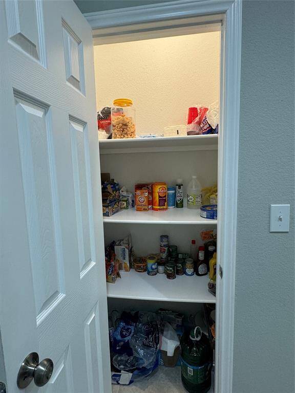 This modern living features a spacious pantry