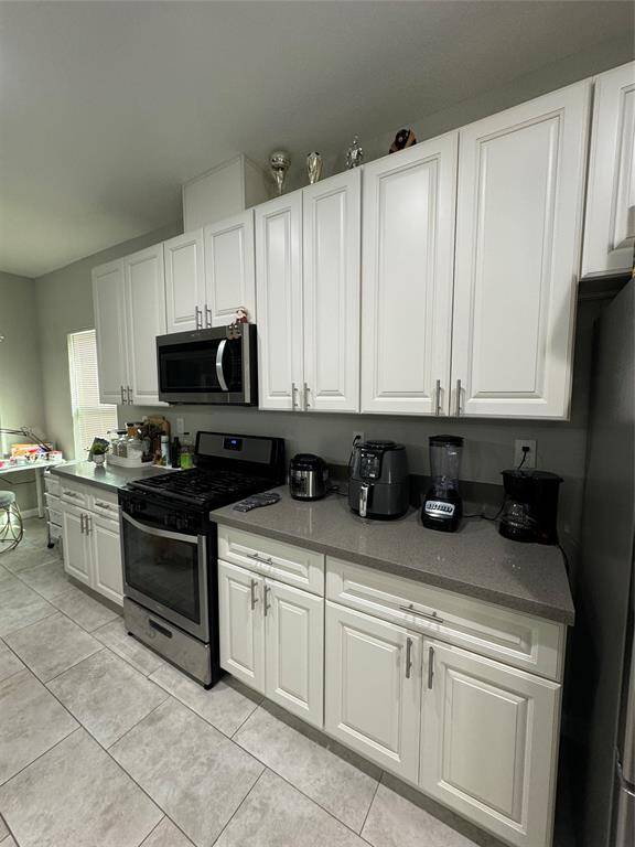 Plenty of cupboards and cabinets in this modern kitchen.
