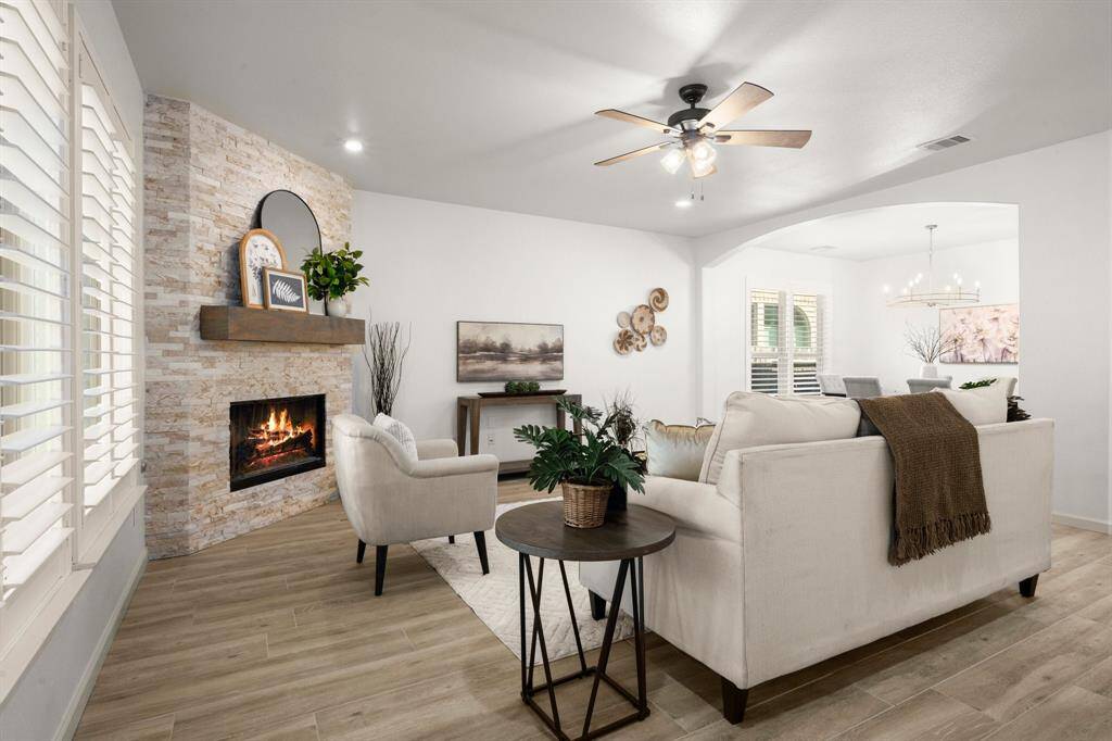 Abundant natural light pours in through plantation-shuttered windows.