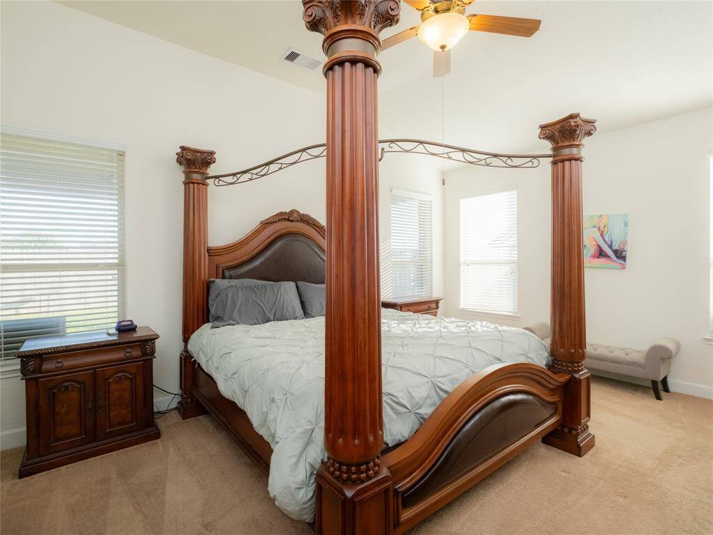 Wow! Check out this well appointed primary bedroom!