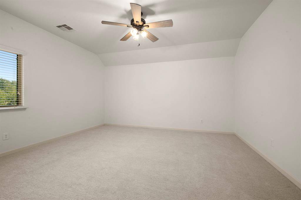 The neutral design creates a versatile space ready to be personalized as a bedroom, home office, or hobby room.