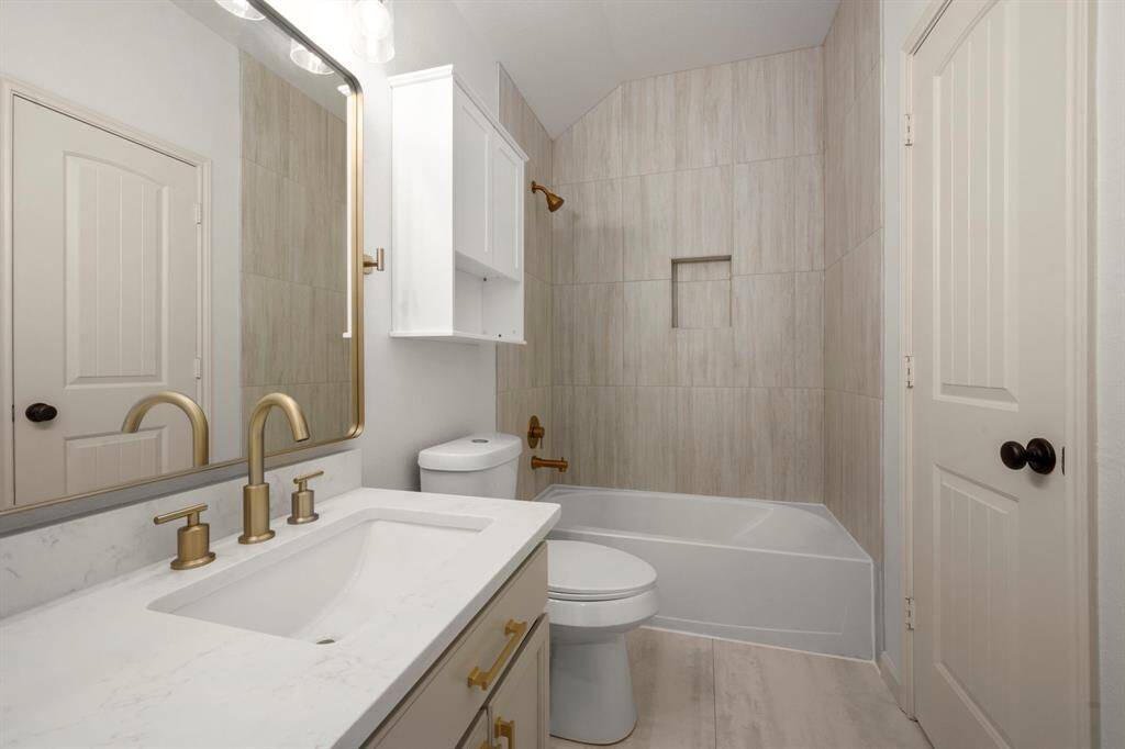 The combination of neutral tones and modern finishes creates a calming and functional space for daily routines.