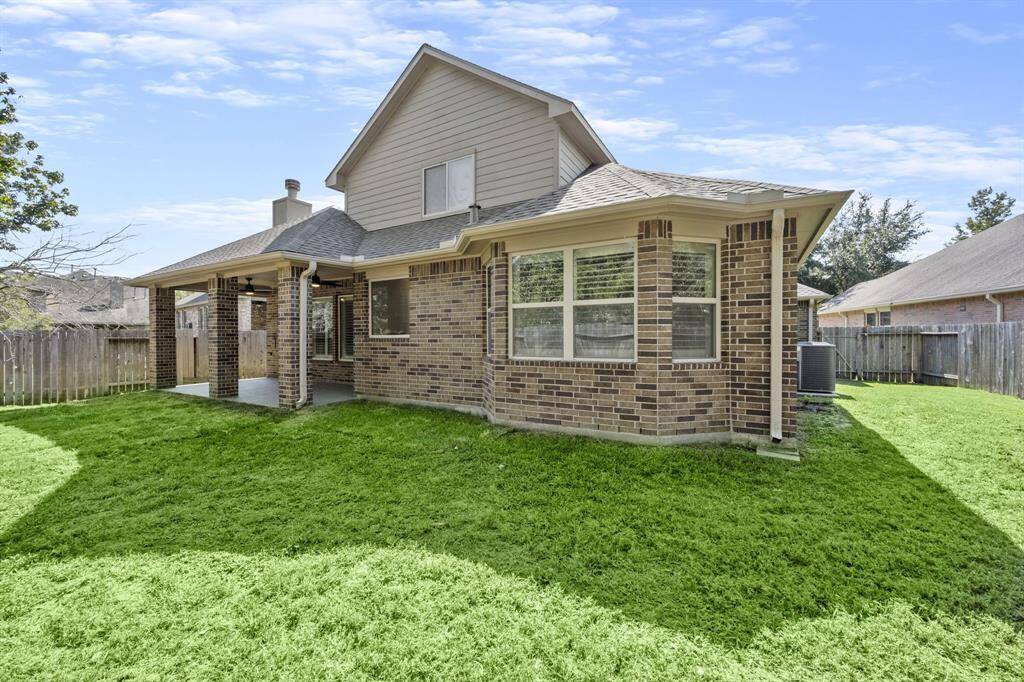 The spacious backyard offers plenty of room for outdoor activities and relaxation.