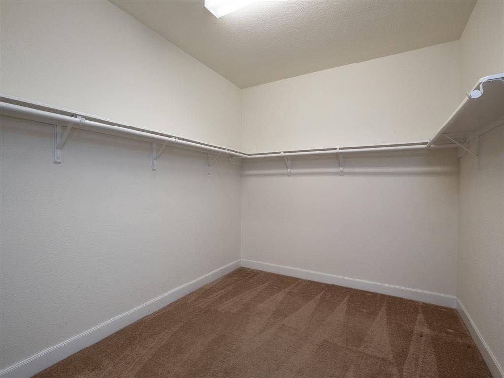 You will be able to fit all your clothes in this large walk in closet!