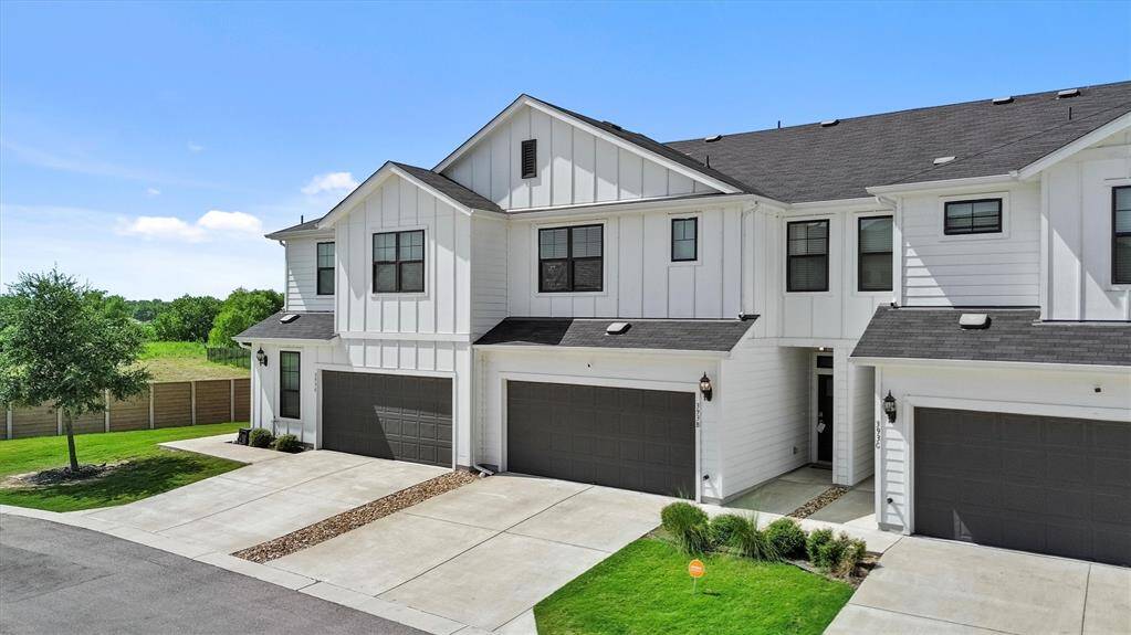 The 2 car garage front in this barely lived in condo