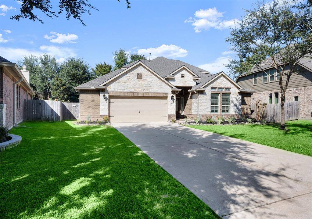 The blend of stone and brick adds timeless elegance to this quiet cul-de-sac property.