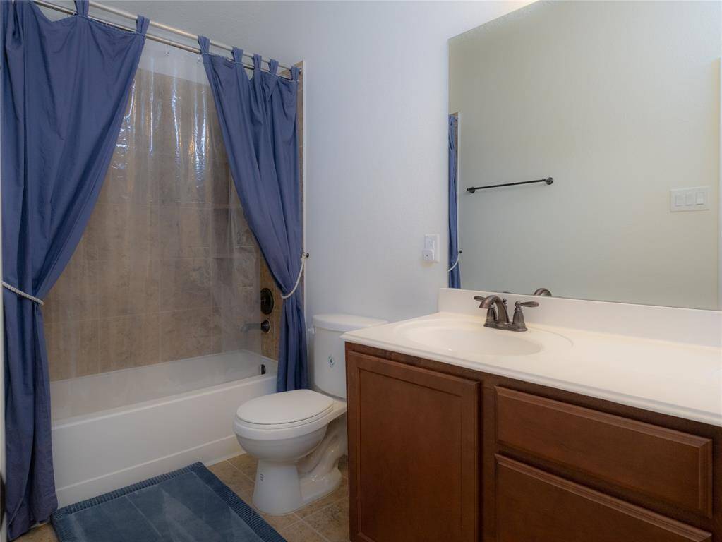 The 3rd and 4th bedrooms share this full bathroom.