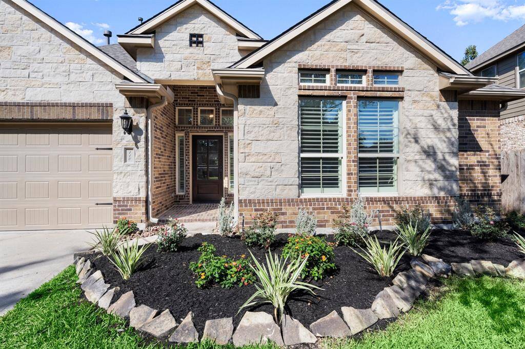 The covered porch adds a warm and welcoming touch to this modern home.