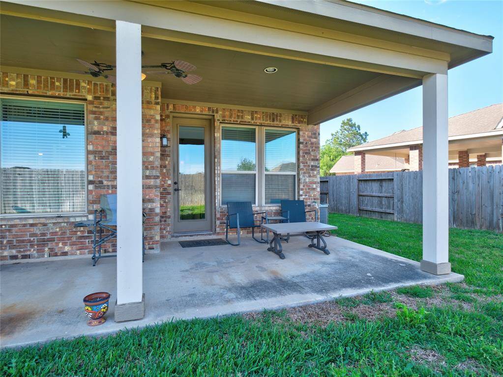 The patio has the perfect space to add a sitting area!