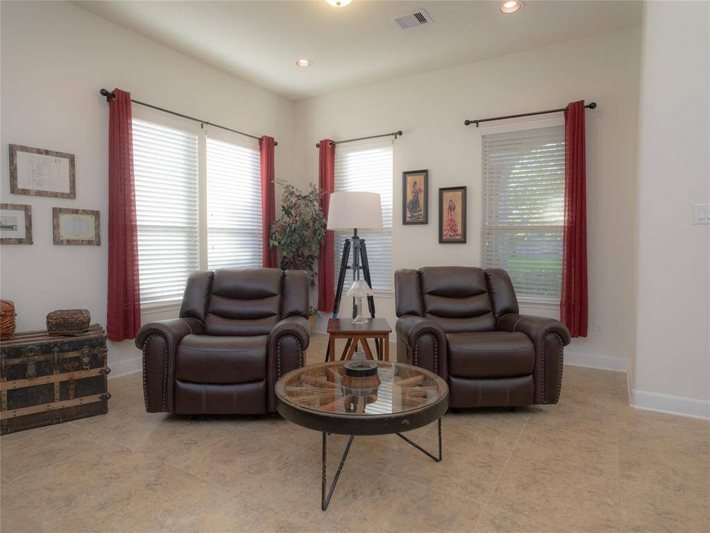 Another view of the family room with all the windows and check out the high ceilings!
